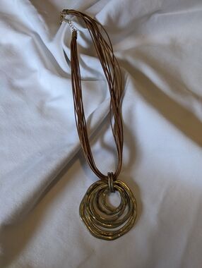 Multi-Strand Brown Necklace with Layered Gold Rings Pendant